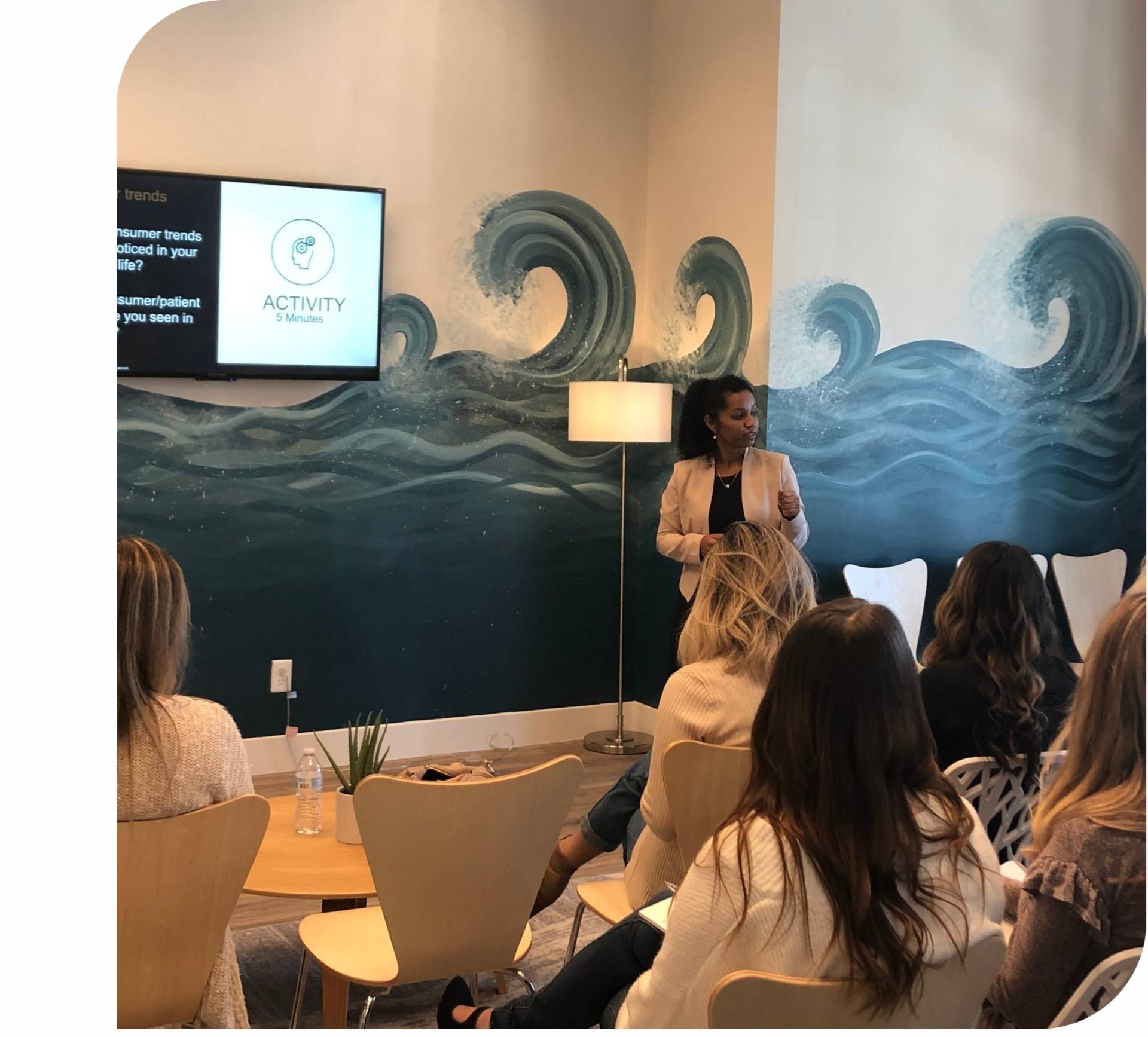 Debbie Khedoo teaching a continuing education session to an attentive audience